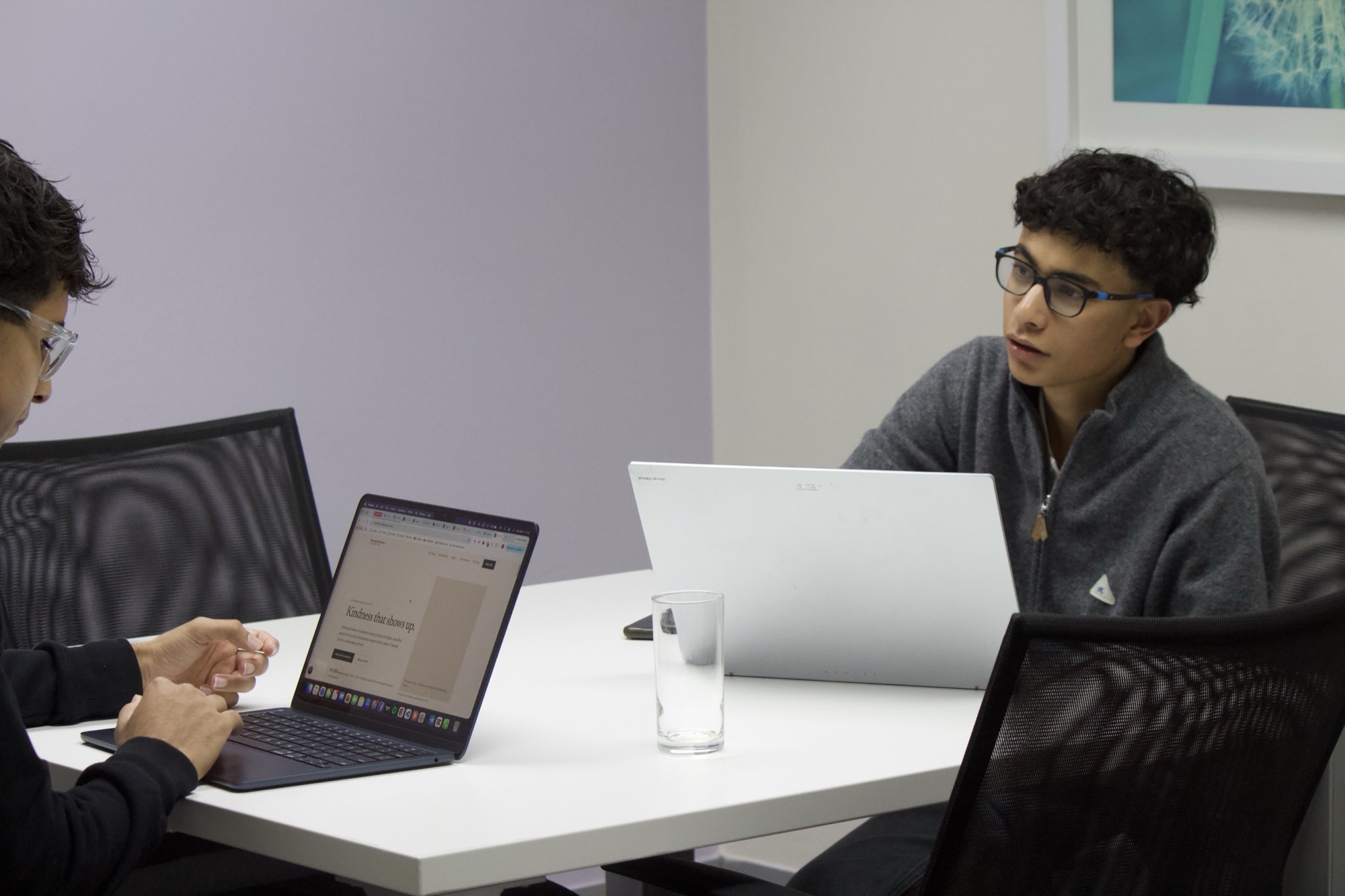 Two TechXplo Foundation students working together on laptops